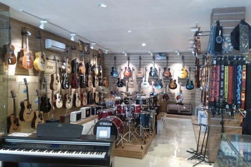 Musical instrument showroom with guitars, keyboards and drums